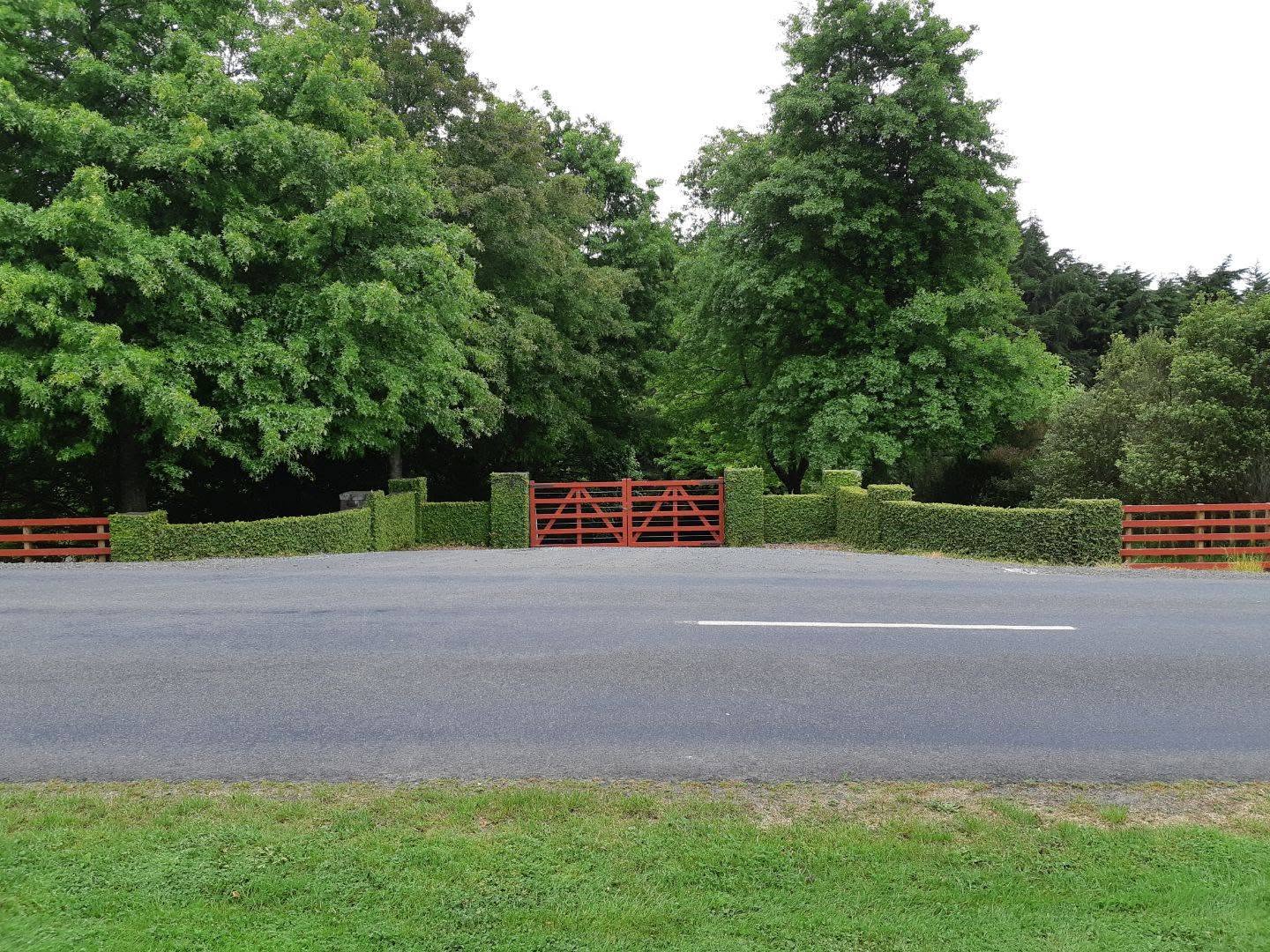 The barnyard-red gates at the entrance