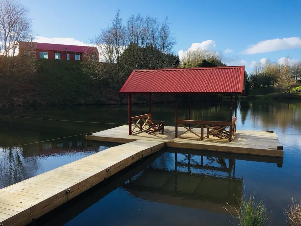 The covered floating dock on the lake